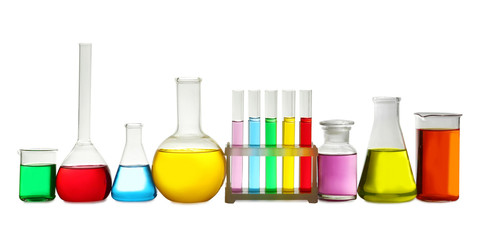 Laboratory glassware with colorful liquids on white background