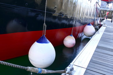 Air filled fenders used to protect the ships hull against damage from the dockside