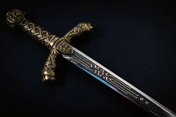 Fotobehang Knight sword on a black background © Aleksandr 44ARH