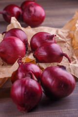 red onions on rustic wood