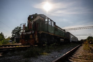 Fototapeta na wymiar Rusty train on abandoned railway line
