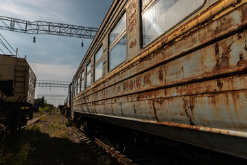 Fototapeta na wymiar Old rusty train car / carriage on abandoned railway line