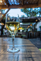 glass of white wine in the evening
