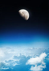 Naklejka na ściany i meble Border of sky with clouds and space with Moon. Blue and dark. Stratosphere. Space wallpaper. Elements of the image furnished by NASA.