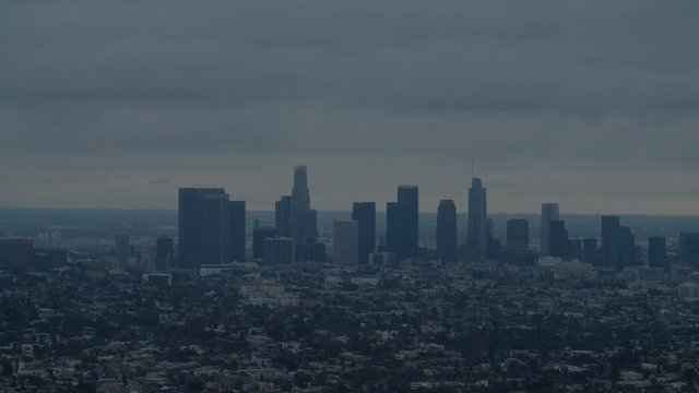 FIXED EST DUSK Establishing shot of Los Angeles Downtown from Griffith observatory. 4K UHD