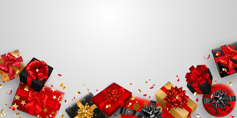Vector illustration of red, black and golden gift boxes with ribbons, bows and shadows, and small shiny pieces of serpentine on white background