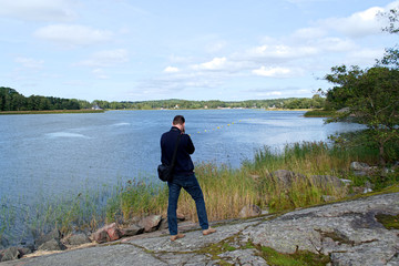 photographer photographing the surface of the lake