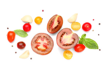 Fresh tomatoes and spices on white background