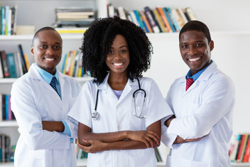 General practitioner and doctor and nurse as african american medical team - Powered by Adobe
