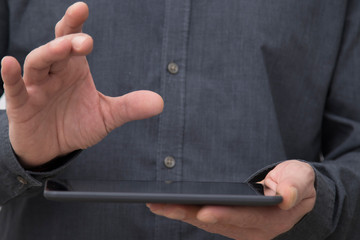 closeup of businessman hands with tablet or digital book