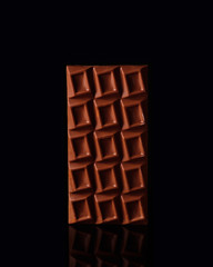 Chocolate on black background color fruit