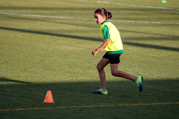 Little girl in a soccer training