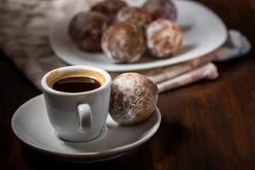 mini cheese donuts and a cup of coffee