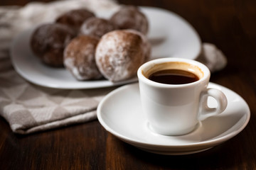 mini cheese donuts and a cup of coffee