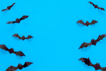 Bats cutout on Halloween frame on blue table top view space for text