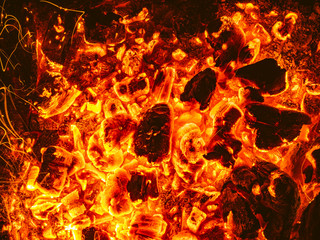Top View of Glowing Embers in Fireplace, Burning Wood at High Temperature and Flying Sparks