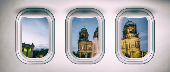 Airplane interior with window view of Berlin City, Germany. Concept of travel and air transportation