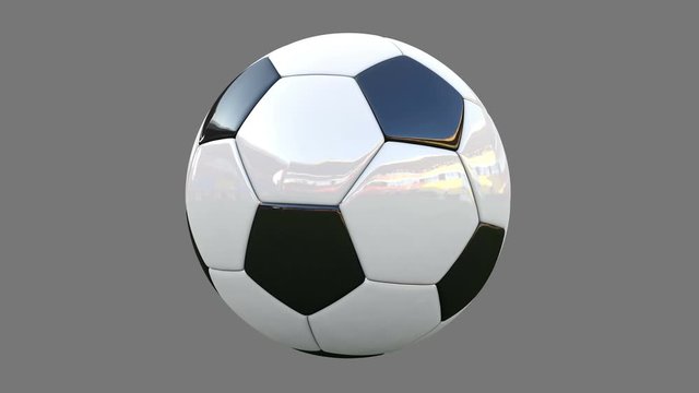 Rotation of a realistic soccer ball on a gray background. animation has alpha channel