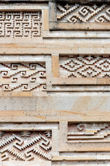 Close up of intricate mosaic fretwork of the geometric patterns called grecas. Mitla, Mexico - obrazy, fototapety, plakaty