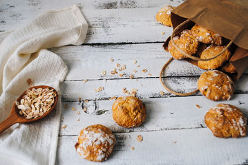 Cookies lie on a white wooden table.