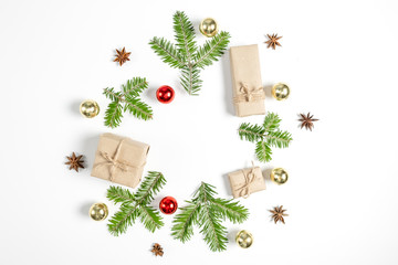 Christmas or winter composition. Handmade gift boxes decorated with craft paper of fir tree branches, on white background. Flat lay, top view, copy space
