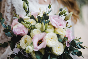 Obraz na płótnie Canvas Wedding Bridal Bouquet. Bridal bouquet of white and pink colors. Bride with bouquet, closeup