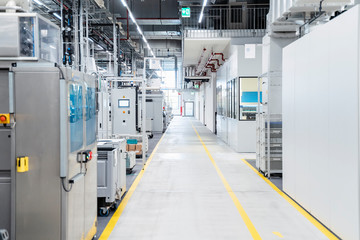Footpath along industrial machinery in modern factory, Stuttgart, Germany