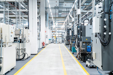 Footpath between industrial machinery in modern factory, Stuttgart, Germany
