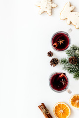 Romantic New Year with two glasses of mulled wine on white background top view frame copy space