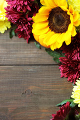 Autumn background with border made beautiful colorful flowers. Top view.