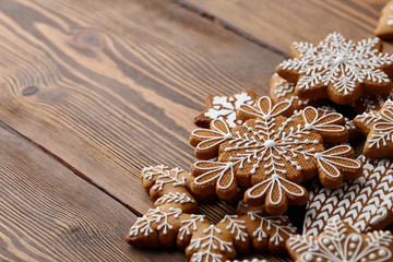 Christmas gingerbread cookies on brown planks