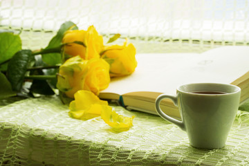 cup of tea with yellow tulips