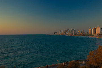 travel mobile photography with noise pollution of Tel Aviv Israeli capital city urban Mediterranean waterfront scenery landmark view in evening twilight time after sunset 