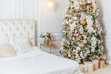 Classic christmas New Year decorated interior room New year tree. Christmas tree with golden...