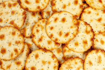 Wafer thin golden brown round crackers