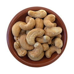 Bowl of roasted and salted cashews on a white background.