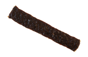 Single piece of venison jerky on a white background
