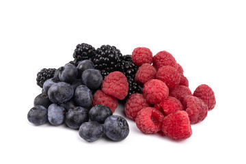 Side view on a set of organic blackberries, blueberries and raspberries