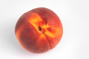 Close-up top view on one yellow and red organic peach