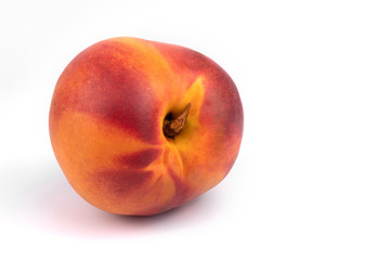 Front close-up view of one organic juicy nectarine om white background