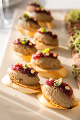 Cold Snack On The Festive Table. Liver Pate With Berry Jam On A White Toasted Bread Crate