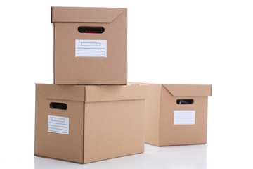 A lot of carton box of kraft color. Theme of moving the loading of unloading cargo delivery of goods from the Internet to the purchaser from the supplier