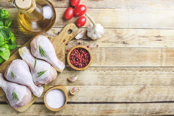 Raw organic chicken legs with ingredients