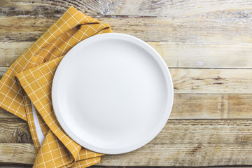 Elegant empty plate, cutlery and napkin