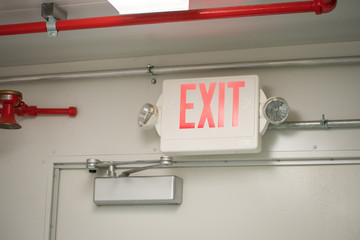 Emergency exit sign into a the industry room.