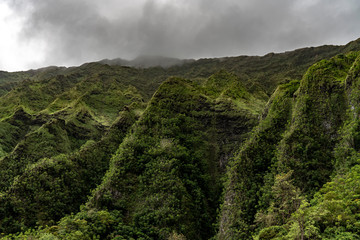 The Waianae Mountain Range in Oahu Hawaii during low clouds before a storm.