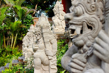 Detail of statues and sculptures placed in the garden outside Ubud Palace Puri Saren Agung, home of the Ubud royal family and one of the most visited spots of the whole city.