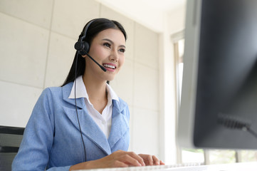 Call Center Service. Photo of customer support or sales agent.  Help line answering and telemarketing. Female caller or receptionist phone operator.Copy space for some text, advertising or slogan.