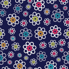 Beautiful bright geometric flowers seamless pattern on a navy blue background. 