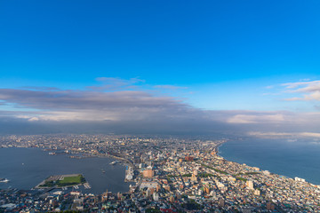 Obraz premium View from Mt. Hakodate observation deck in sunny day, the expansive vista during daytime is spectacular. A famous three star rating sightseeing spot in Hakodate City, Hokkaido, Japan